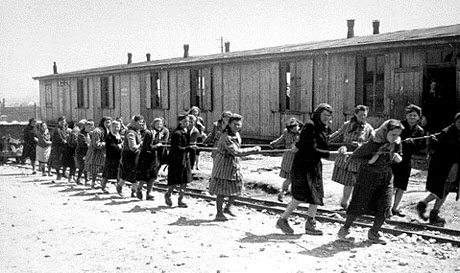 Jewish women at forced labor pulling hopper cars of quarried stones
